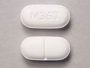 Hydrocodone/Acetaminophen 10-325 mg tablets UK showing front and back view of prescription opioid pain medication on a clean medical background