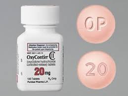 White to off-white round OxyContin 20 mg prolonged-release tablet for UK reference, marked “OP” and “20”