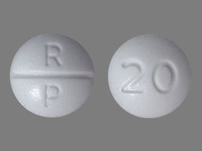Close-up of Oxycodone 20 mg prolonged-release tablets in secure UK blister pack, showing dosage imprint and MHRA-compliant labelling for legal prescription opioid pain relief.
