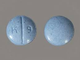 Close-up of Oxycodone 30 mg prolonged-release tablets in blister pack, featuring the standard UK branding and dosage imprint, representing legal prescription opioid medication for severe pain relief.