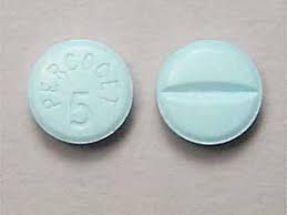 Front and back view of Percocet 5/325 mg UK packaging, with the tablet shown beside it